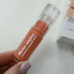 Сяючий сонцезахисний блиск для губ з пептидом HUGS Mirror Sungloss Sparkling Bellini - 5.5 мл - зображення 6